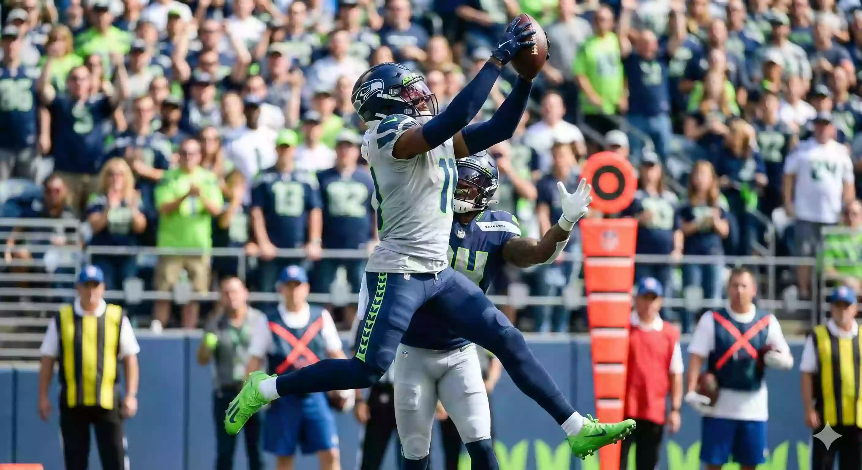 An athletic cornerback intercepting a pass intended for a wide receiver